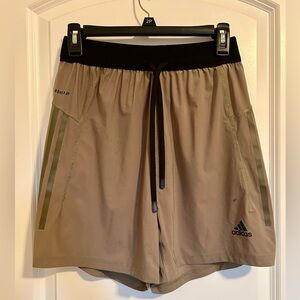 Men’s beige and black striped Adidas athletic shorts